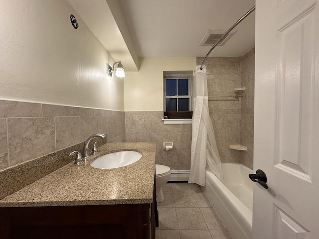 full bathroom with shower / tub combo, toilet, baseboard heating, vanity, and tile patterned floors