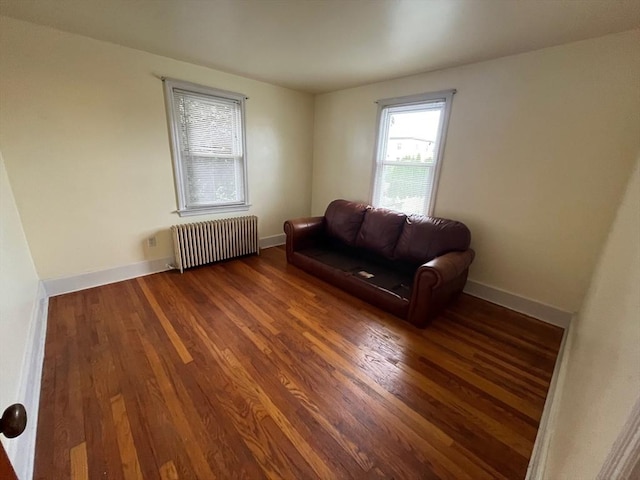 189 Bush St, Fall River, MA 02724 - sitting room featuring radiator heating unit, wood finished floors, and baseboards