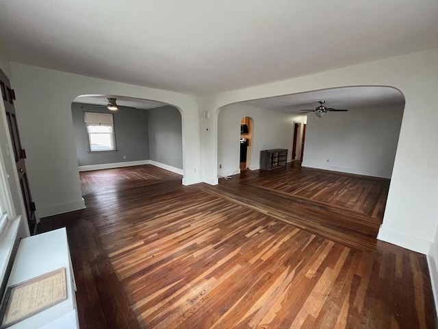 189 Bush St, Fall River, MA 02724 - spare room with a ceiling fan, arched walkways, and hardwood / wood-style flooring