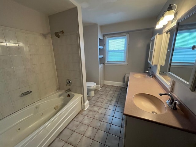 189 Bush St, Fall River, MA 02724 - full bath featuring tile patterned floors, toilet, double vanity, a combined bath / shower with jetted tub, and baseboards