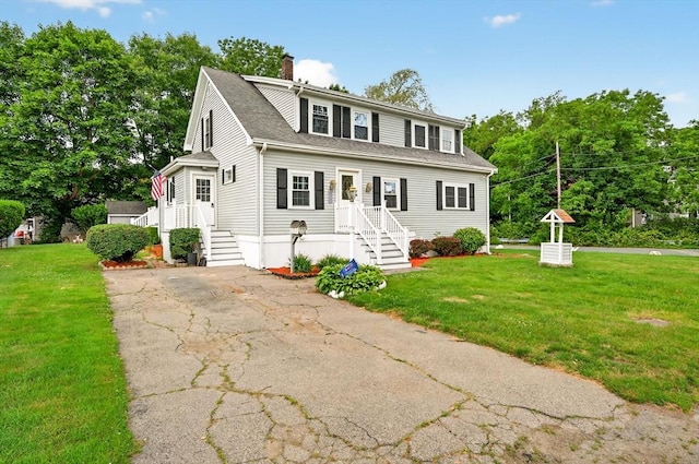 70 Hancock St, Whitman, MA 02382 - view of front of property with a chimney, a front lawn, and roof with shingles