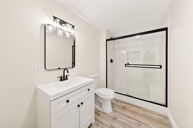 70 Hancock St, Whitman, MA 02382 - bathroom featuring a shower stall, vanity, and wood finished floors