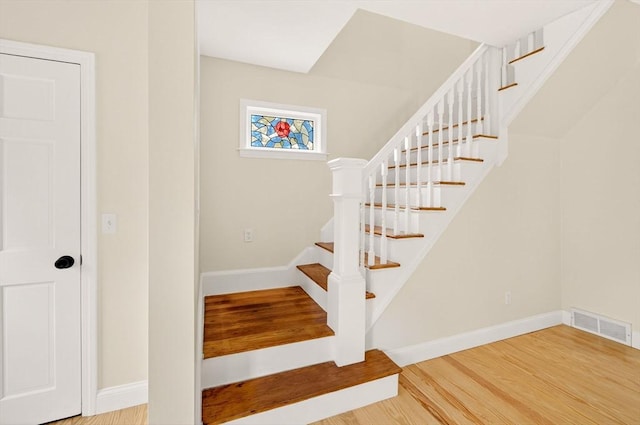 70 Hancock St, Whitman, MA 02382 - stairway with wood finished floors and baseboards