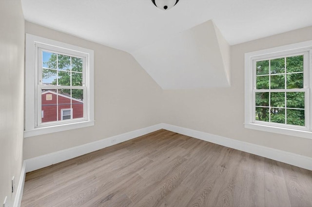 70 Hancock St, Whitman, MA 02382 - additional living space featuring wood finished floors and vaulted ceiling