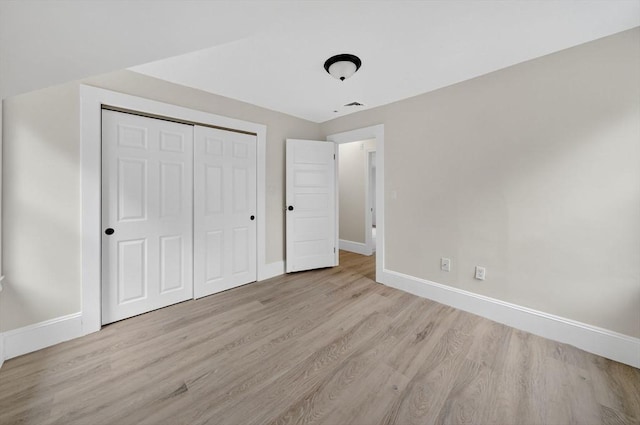 70 Hancock St, Whitman, MA 02382 - unfurnished bedroom featuring wood finished floors and a closet