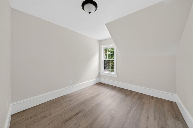 70 Hancock St, Whitman, MA 02382 - additional living space featuring wood finished floors and vaulted ceiling
