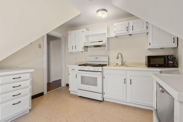 kitchen featuring white gas stove, under cabinet range hood, white cabinetry, black microwave, and light floors