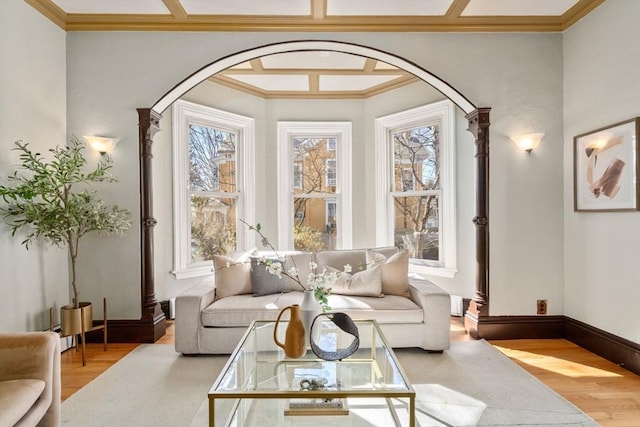 interior space with arched walkways and coffered ceiling