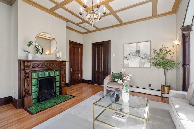 living room with a baseboard heating unit, baseboards, coffered ceiling, and wood finished floors