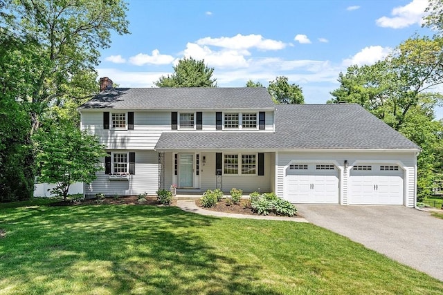 21 Johnson Rd, Winchester, MA 01890 - view of front facade featuring an attached garage, driveway, a chimney, a porch, and a front yard