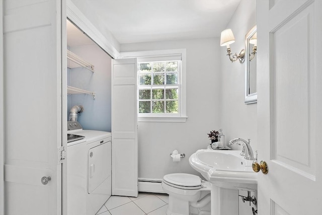 21 Johnson Rd, Winchester, MA 01890 - half bathroom featuring washer and dryer, tile patterned floors, a baseboard radiator, toilet, and baseboards
