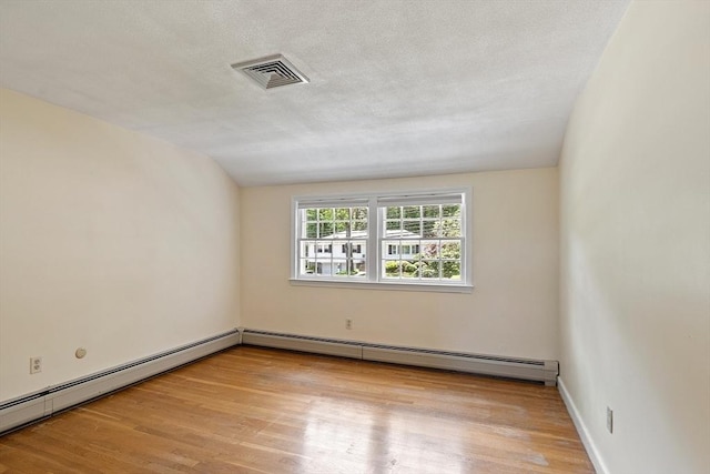 21 Johnson Rd, Winchester, MA 01890 - spare room with a baseboard radiator and light wood finished floors