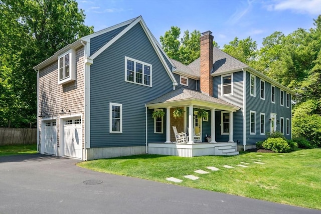 172 Carolyn Cir, Marshfield, MA 02050 - view of front of house with a porch, a chimney, driveway, and an attached garage