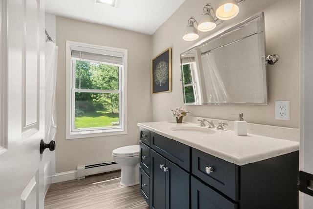 172 Carolyn Cir, Marshfield, MA 02050 - bathroom with a baseboard radiator, vanity, wood finished floors, and curtained shower