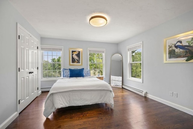 172 Carolyn Cir, Marshfield, MA 02050 - bedroom featuring baseboard heating, multiple windows, and wood finished floors