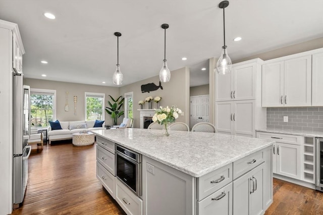 172 Carolyn Cir, Marshfield, MA 02050 - kitchen with open floor plan, recessed lighting, stainless steel fridge, and white cabinetry