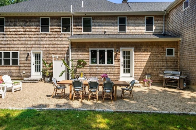 172 Carolyn Cir, Marshfield, MA 02050 - back of house featuring a shingled roof and a patio area