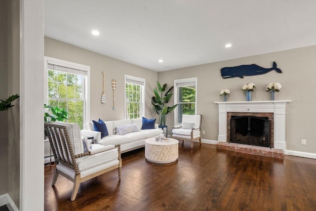 172 Carolyn Cir, Marshfield, MA 02050 - living area with plenty of natural light, wood finished floors, a fireplace, and recessed lighting