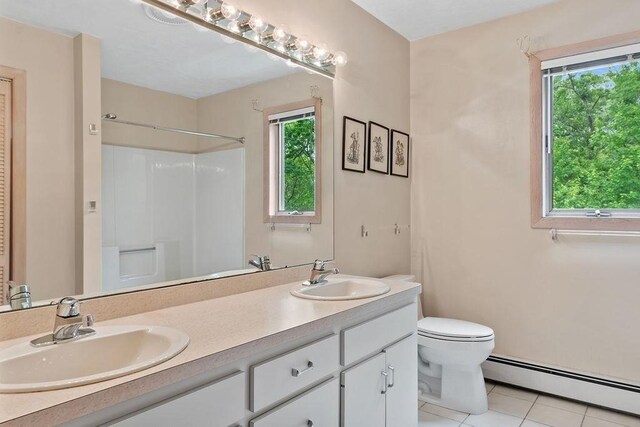 230 Prospect St, Franklin, MA 02038 - bathroom featuring a baseboard heating unit, double vanity, tile patterned flooring, toilet, and a shower