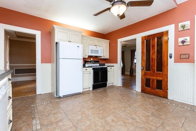 13 Mullin Ave, Quincy, MA 02169 - kitchen with white appliances, ceiling fan, wainscoting, and white cabinets