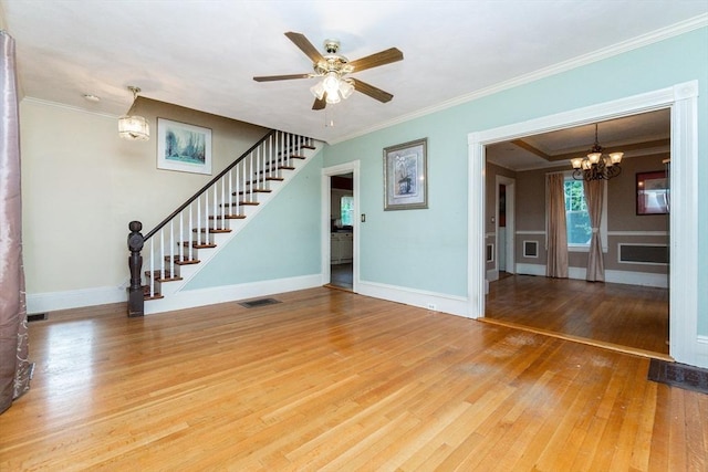 13 Mullin Ave, Quincy, MA 02169 - unfurnished living room featuring hardwood / wood-style flooring, a chandelier, stairway, crown molding, and a ceiling fan