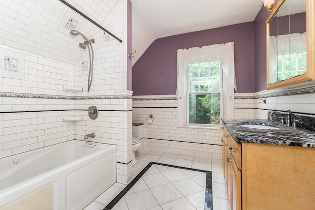 13 Mullin Ave, Quincy, MA 02169 - bathroom with vanity, tile walls, washtub / shower combination, tile patterned flooring, and wainscoting