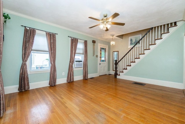 13 Mullin Ave, Quincy, MA 02169 - foyer featuring stairs, light wood-type flooring, ceiling fan, and crown molding