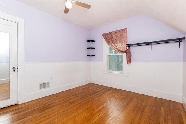 13 Mullin Ave, Quincy, MA 02169 - spare room with hardwood / wood-style flooring, a wainscoted wall, ceiling fan, and vaulted ceiling