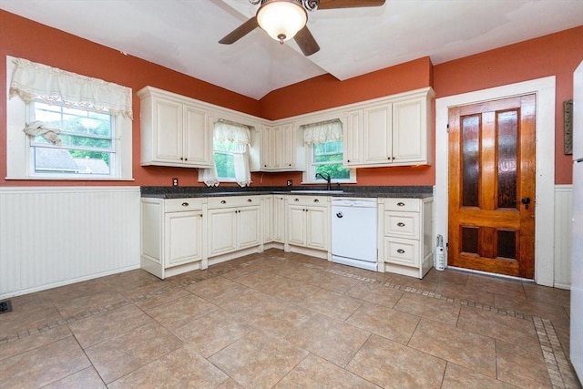 13 Mullin Ave, Quincy, MA 02169 - kitchen with dishwasher, ceiling fan, a wainscoted wall, dark countertops, and lofted ceiling