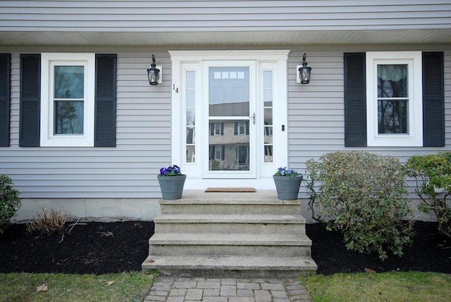 view of exterior entry with covered porch