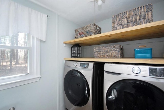 laundry area featuring ceiling fan, laundry area, and washer and clothes dryer