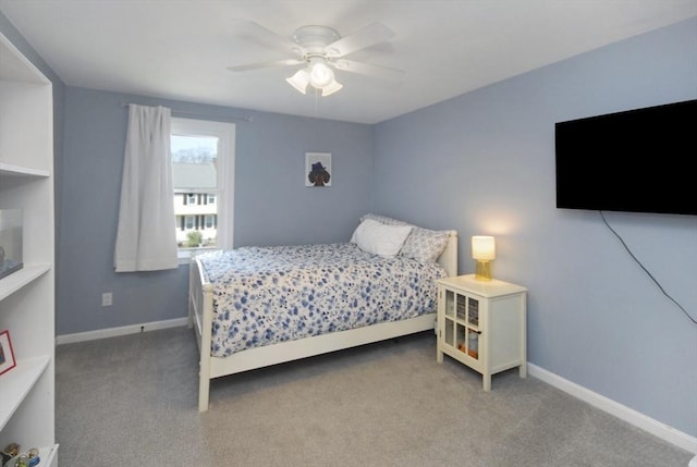 carpeted bedroom with baseboards and ceiling fan