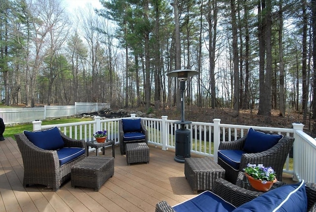 deck with fence and outdoor lounge area