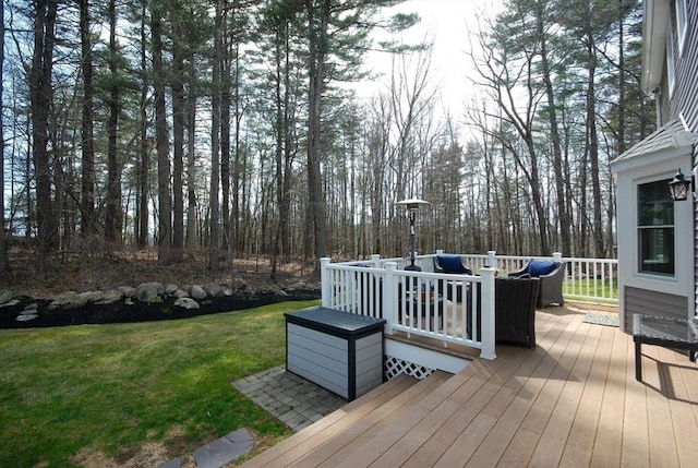 deck with a lawn and outdoor lounge area