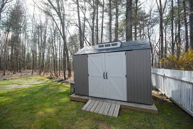 view of shed with fence