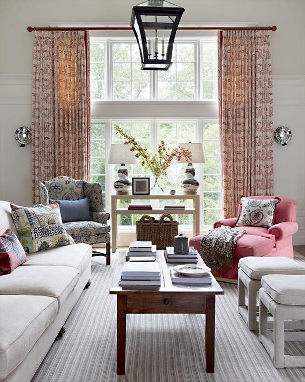 sunroom / solarium with a chandelier