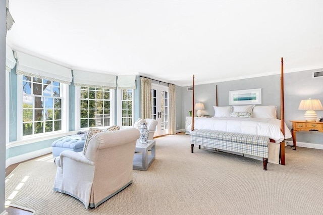 bedroom featuring light colored carpet and crown molding