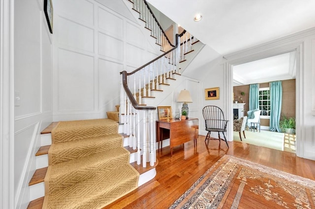 staircase with wood-type flooring