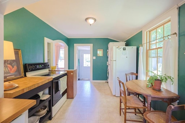 5 Pleasant St, Bourne, MA 02532 - kitchen with electric range, crown molding, vaulted ceiling, and freestanding refrigerator