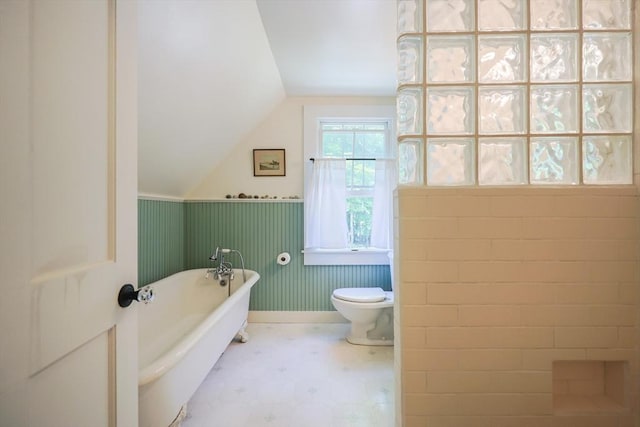 5 Pleasant St, Bourne, MA 02532 - full bathroom with a soaking tub, lofted ceiling, tile patterned floors, and a wainscoted wall