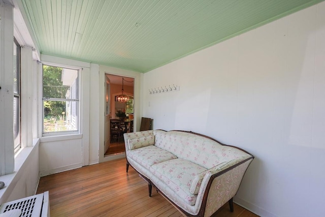 5 Pleasant St, Bourne, MA 02532 - sitting room with wood finished floors and a chandelier