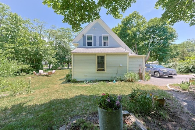 5 Pleasant St, Bourne, MA 02532 - view of home's exterior with a yard