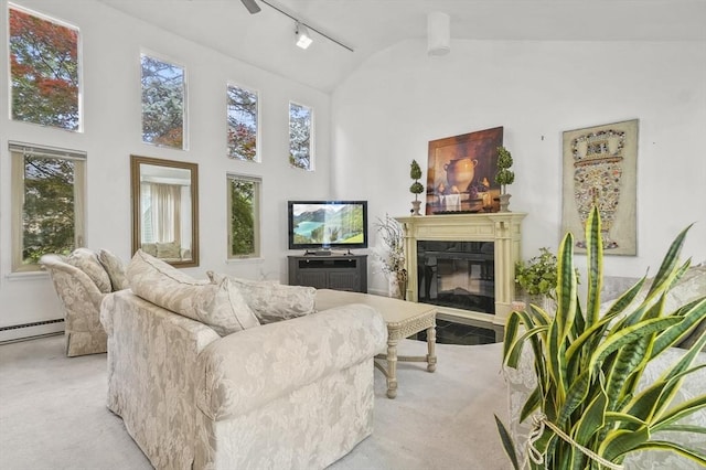 29 Vine St Unit 8, Winchester, MA 01890 - living room featuring light colored carpet, rail lighting, a glass covered fireplace, and high vaulted ceiling