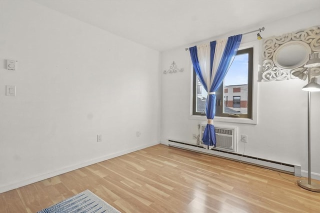 29 Vine St Unit 8, Winchester, MA 01890 - empty room featuring baseboard heating and wood finished floors