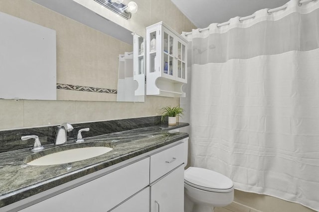 29 Vine St Unit 8, Winchester, MA 01890 - full bathroom with vanity, backsplash, and tile patterned floors