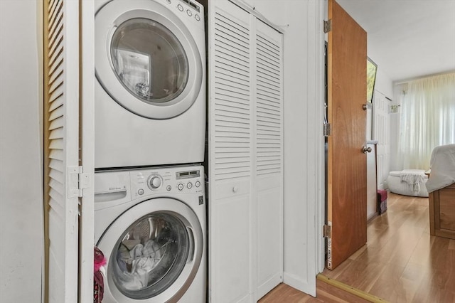29 Vine St Unit 8, Winchester, MA 01890 - laundry room featuring stacked washer and clothes dryer and wood finished floors