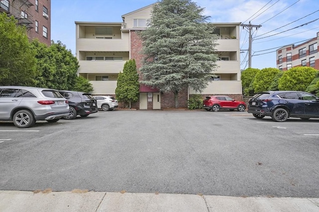 29 Vine St Unit 8, Winchester, MA 01890 - view of building exterior featuring uncovered parking