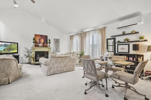 29 Vine St Unit 8, Winchester, MA 01890 - carpeted dining area featuring a wall unit AC, lofted ceiling, a glass covered fireplace, and ceiling fan
