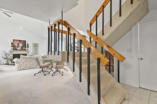 29 Vine St Unit 8, Winchester, MA 01890 - staircase with a ceiling fan, a fireplace, and carpet