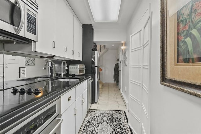 29 Vine St Unit 8, Winchester, MA 01890 - kitchen featuring appliances with stainless steel finishes and white cabinetry